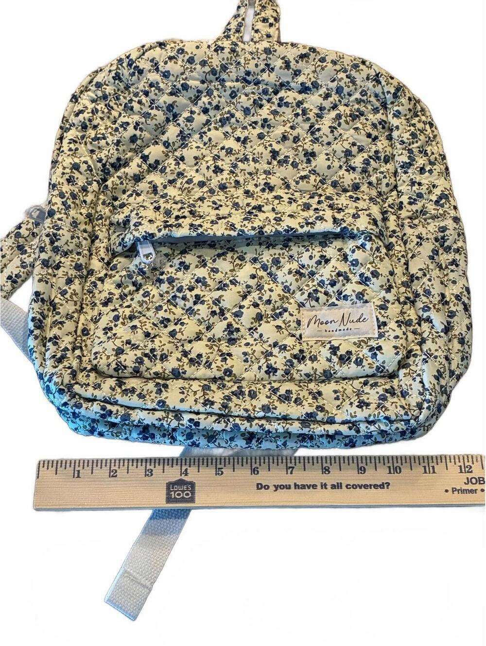 New Moon Nude blue floral quilted backpack